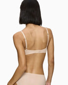 Back view of Triumph nude bra with double-layer wings and hook fastening