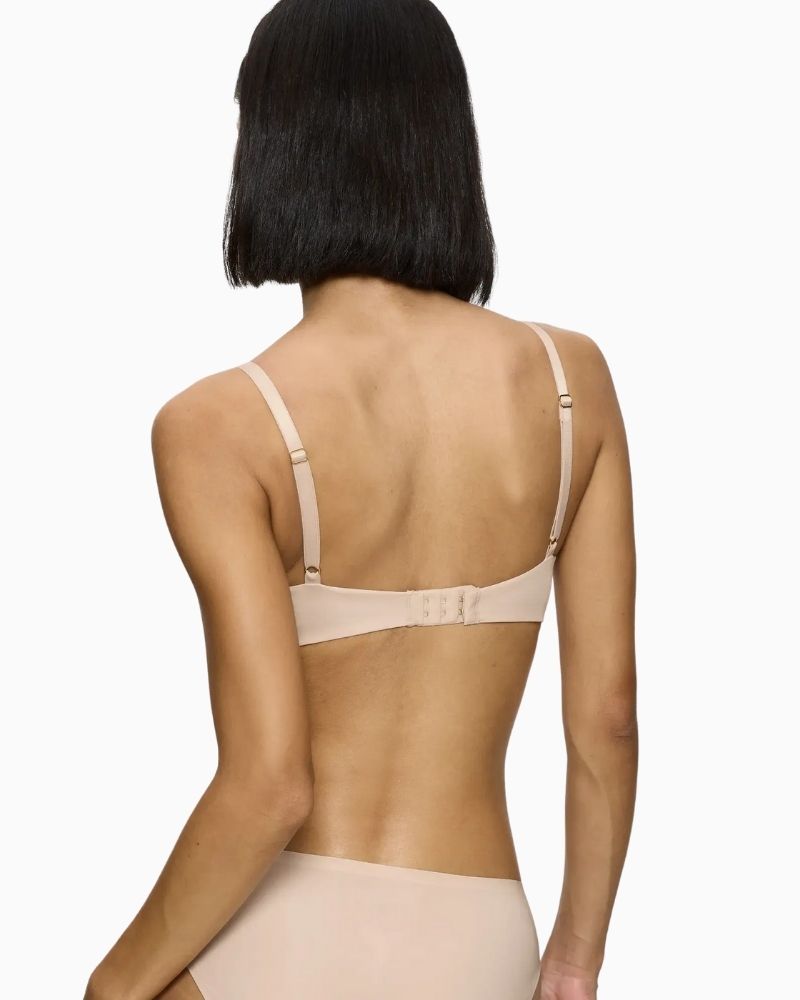 Back view of Triumph nude bra with double-layer wings and hook fastening