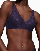 Detail of lace and soft-touch fabric on Triumph Illusion padded bra with subtle branding