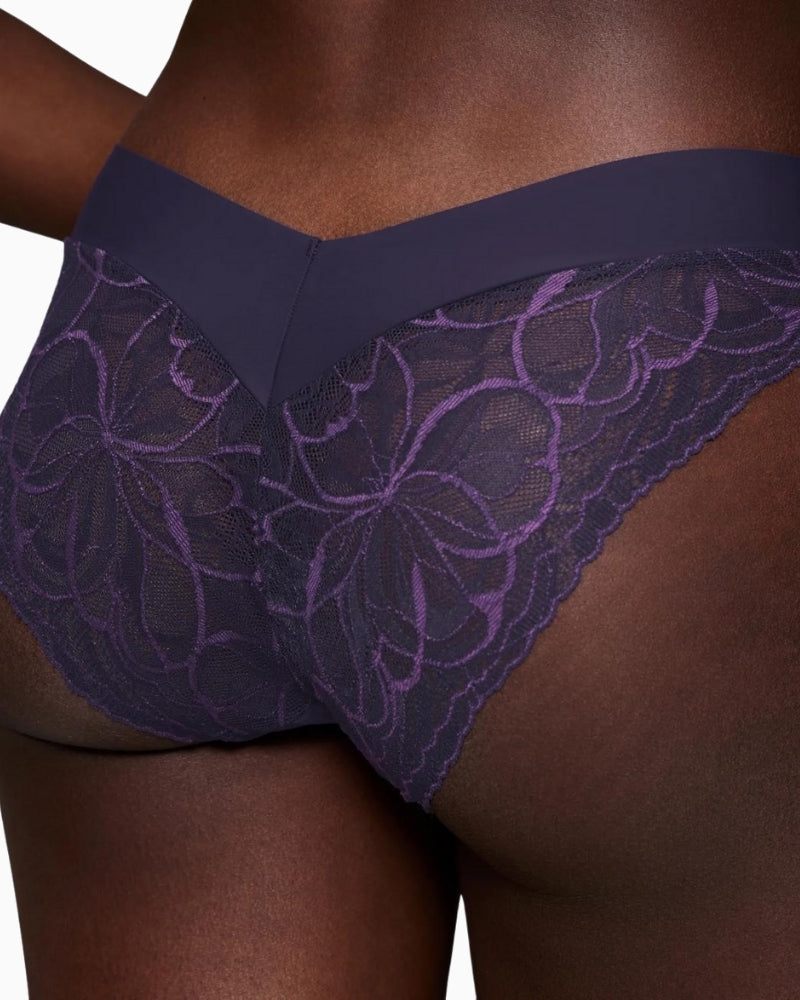 Close-up of lace detailing on Triumph tai briefs with soft stretch waistband