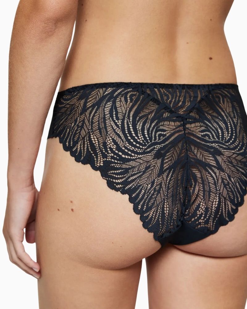 Close view of Triumph seamless microfibre string brief in black