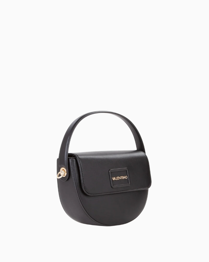 Side view of compact faux leather handbag in classic shape