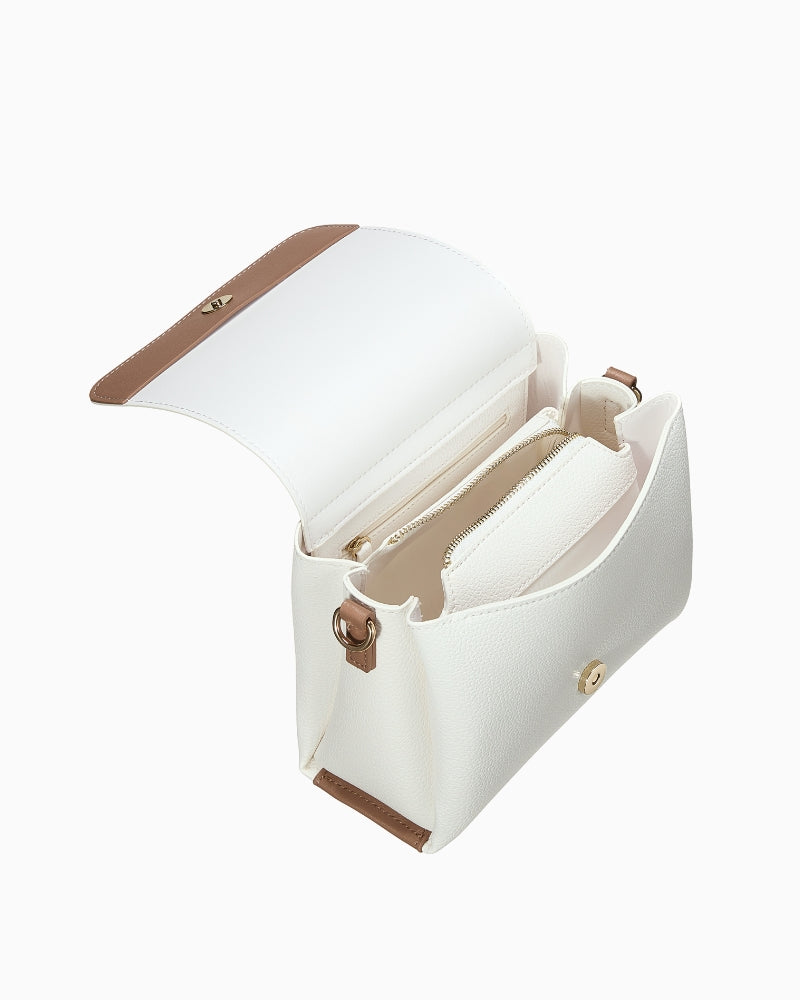 Open view of Valentino Alexia Bag featuring spacious interior, magnetic flap closure, and beige lining