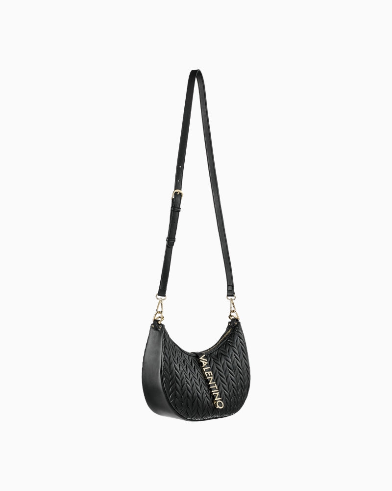 Side view of hobo bag highlighting pleated faux leather texture and roomy curved base