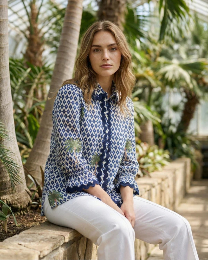 Woman wearing Vilagallo ikat palm print shirt blue and white – Áines Boutique
