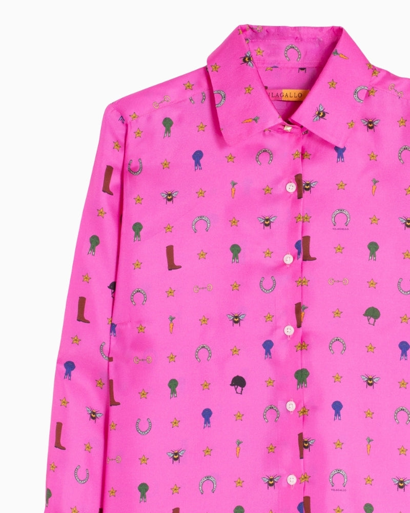 Close-up of equestrian motifs on soft pink silk shirt by Vilagallo