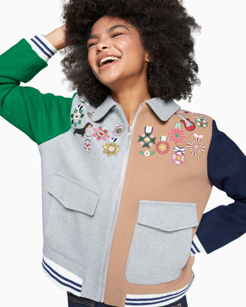 Close-up of commemorative embroidery and zip fastening on Vilagallo bomber