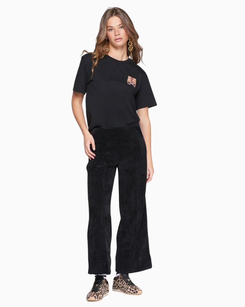 Front view of Vilagallo black corduroy trousers with straight leg, front seams, and patch pockets