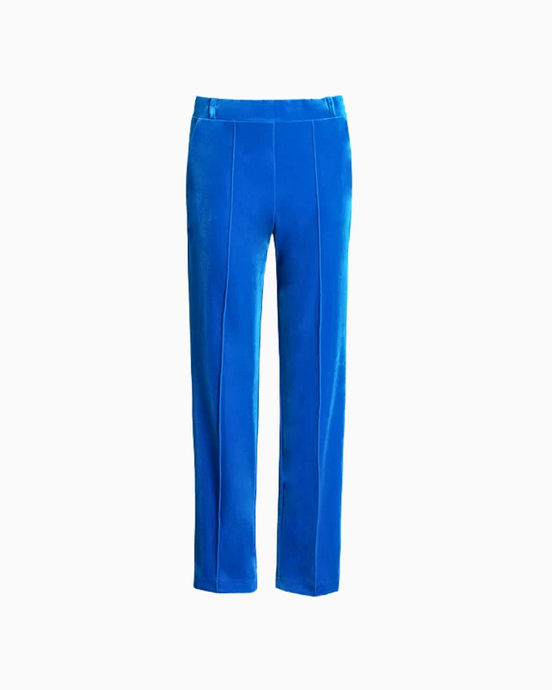 Front view of women’s blue velvet trousers with soft texture