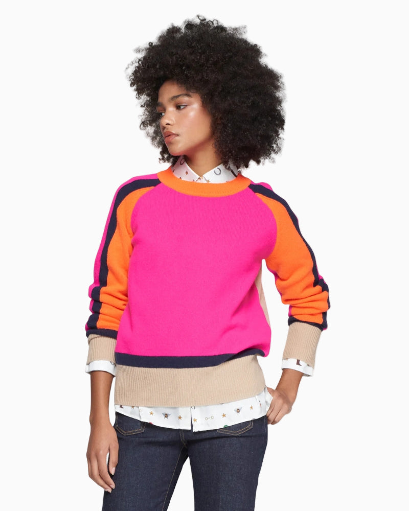 Model wearing relaxed fit Vilagallo jumper showing colour-block sleeve detail