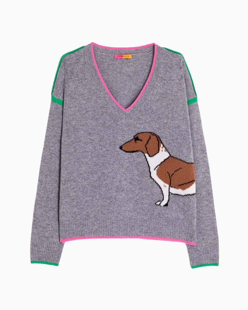 V-neckline detail with pink edge and green stripes on shoulders