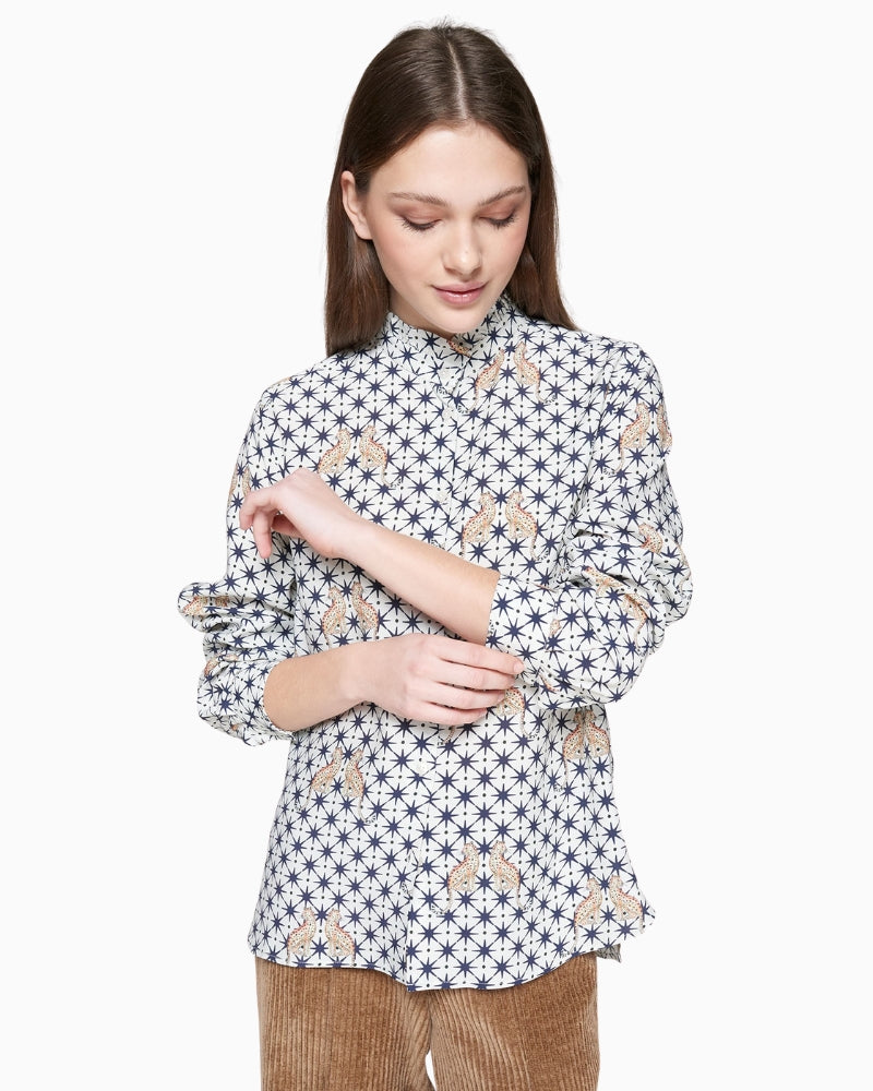 Model wearing relaxed fit printed blouse with long sleeves