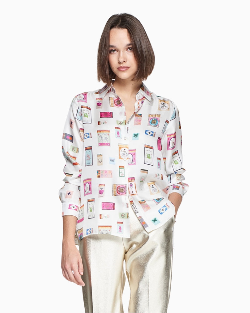 Model wearing soft drape and button front on silk shirt