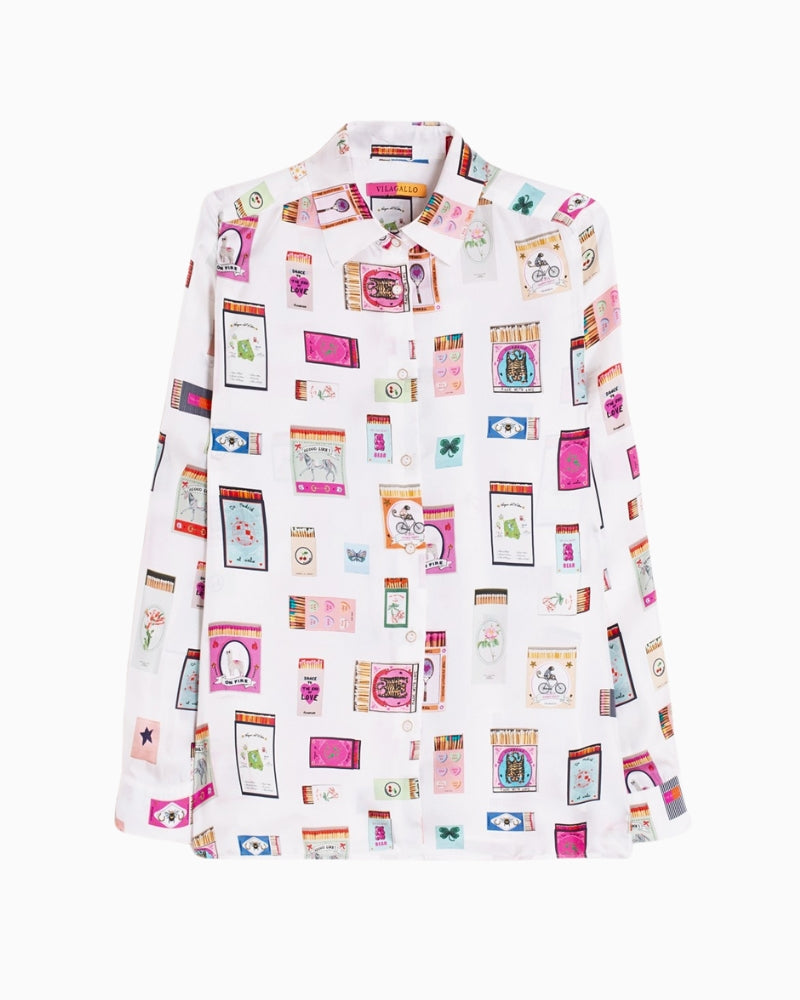 Front view of relaxed straight-fit silk blouse with buttoned cuffs