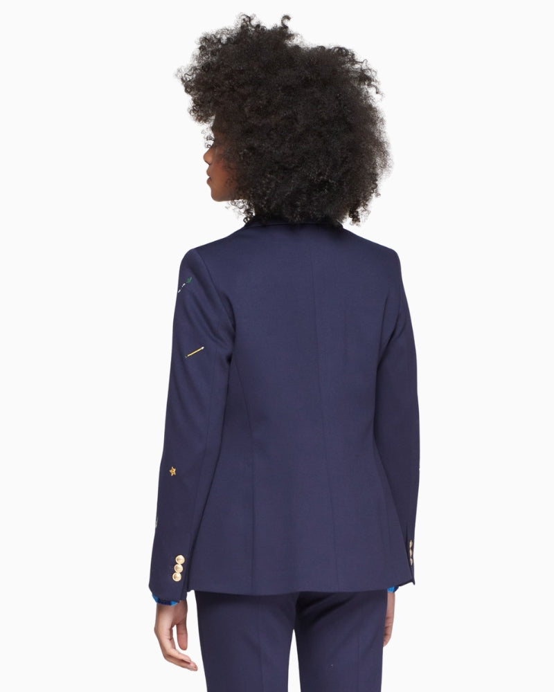 Back view of embroidered navy blazer showing clean tailored cut