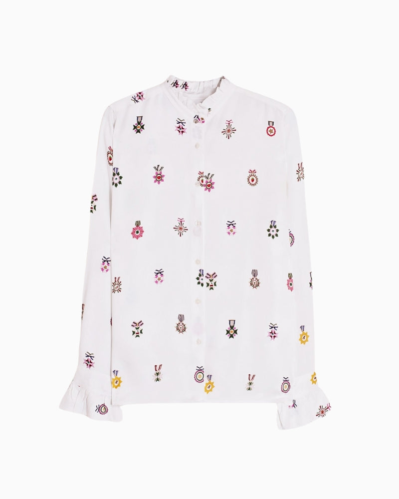 Flat lay view of fabric with colourful rosette pattern