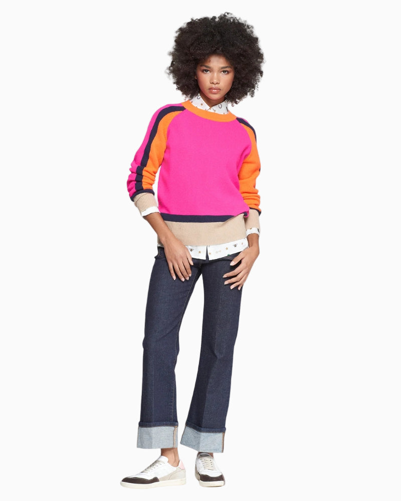 Model wearing Vilagallo colour-block knit with round neck in pink, orange, beige, and navy (front view)