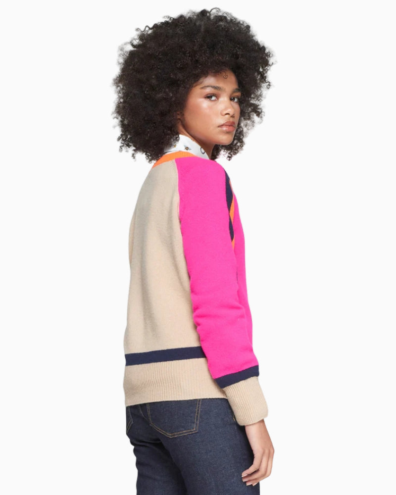 Side view of model wearing relaxed fit Vilagallo jumper showing colour-block sleeve detail