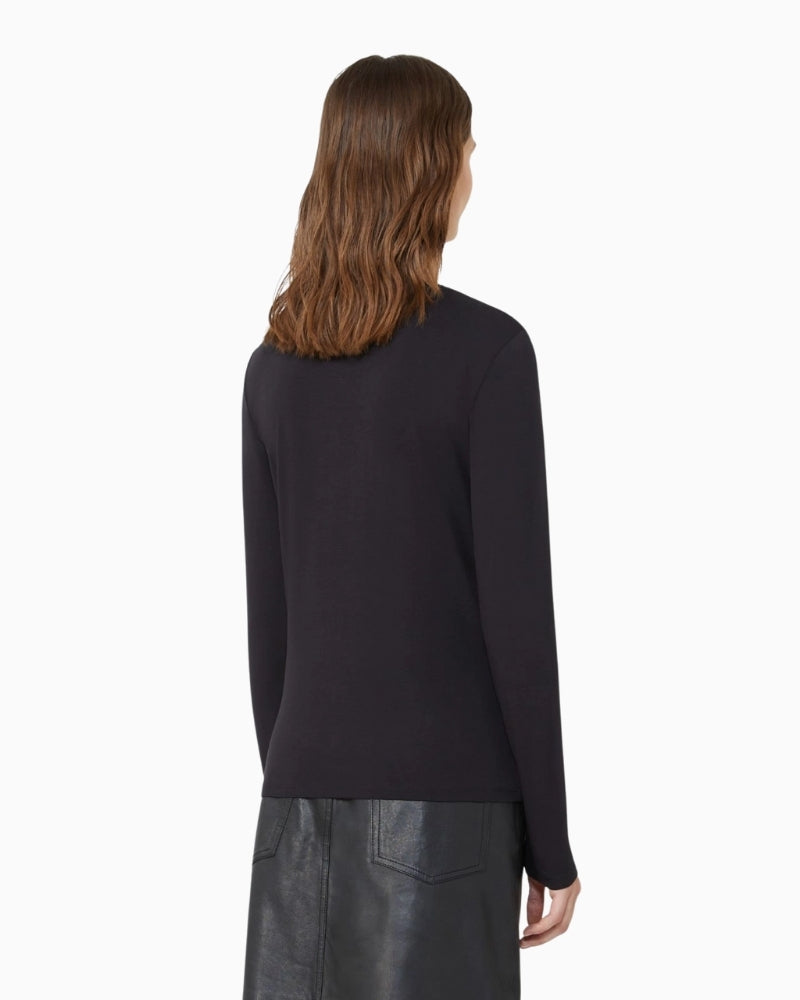 Back view of Multie T-shirt with butterfly logo detail at the collar