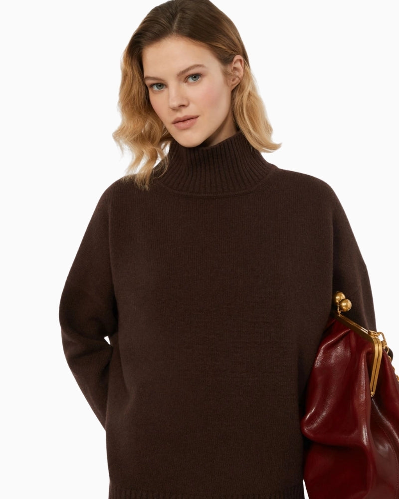 Close-up of ribbed turtleneck and soft virgin wool texture in rich chocolate brown