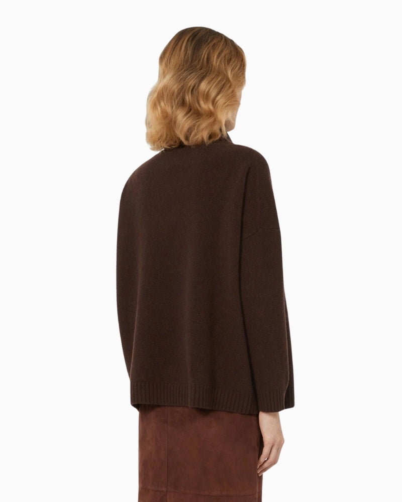 Back view of pure wool chocolate jumper showing relaxed fit and high ribbed neck