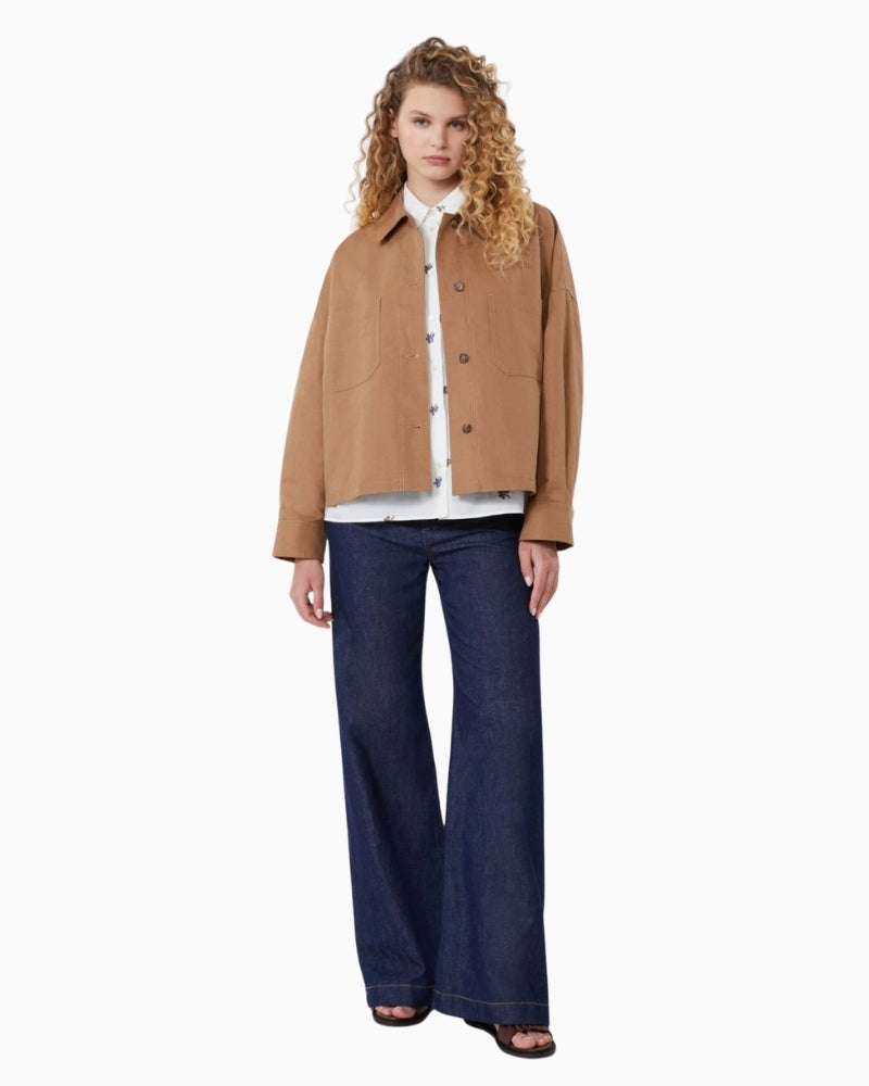 Woman wearing Weekend Max Mara flared jeans navy – Áines Boutique