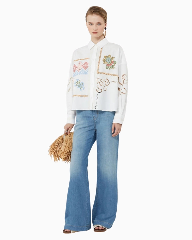 Woman wearing Weekend Max Mara flared jeans – Áines Boutique