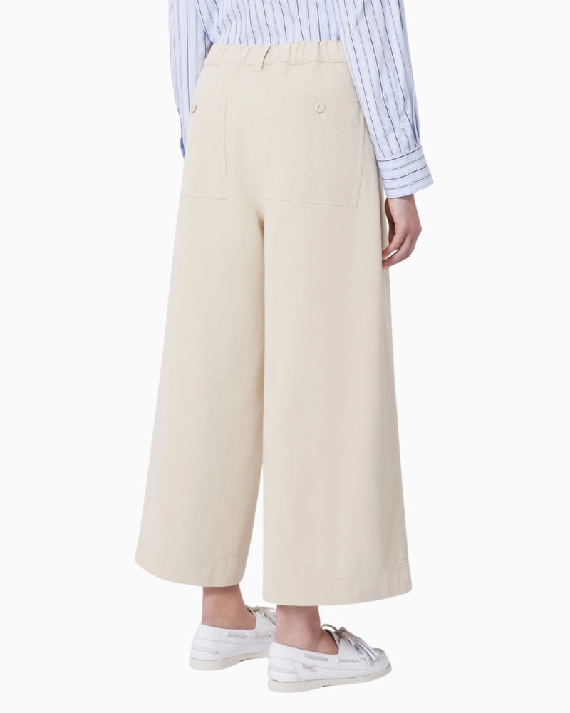 Woman wearing Weekend Max Mara cropped cotton trousers sand, back view – Áines Boutique