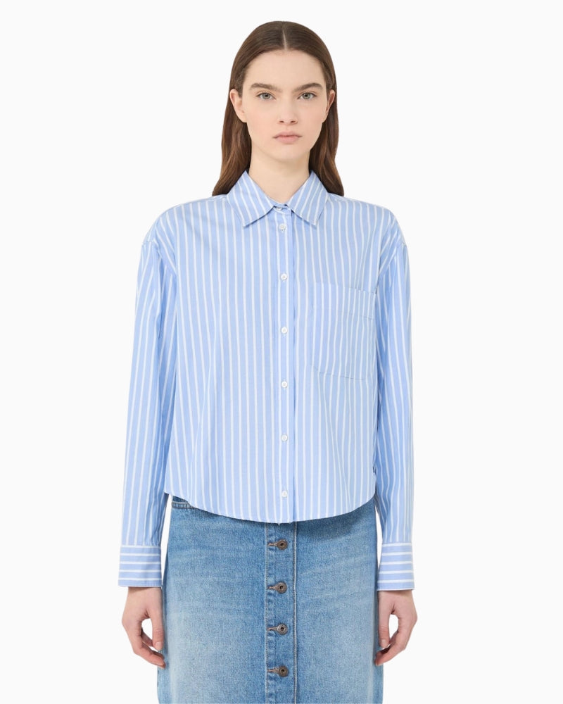 Woman wearing Weekend Max Mara striped cotton shirt light blue, front view – Áines Boutique