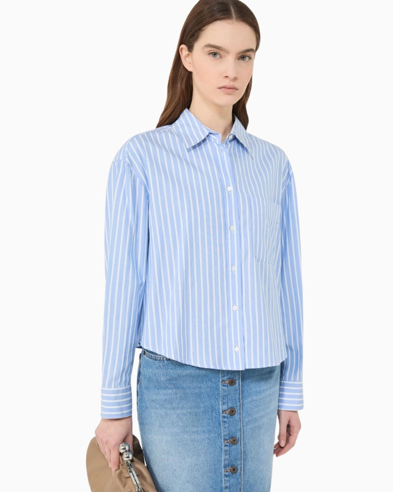 Woman wearing Weekend Max Mara striped cotton shirt light blue, side view – Áines Boutique