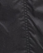 Close-up view of stitching of Barbour Classic Beadnell Jacket in olive wax cotton