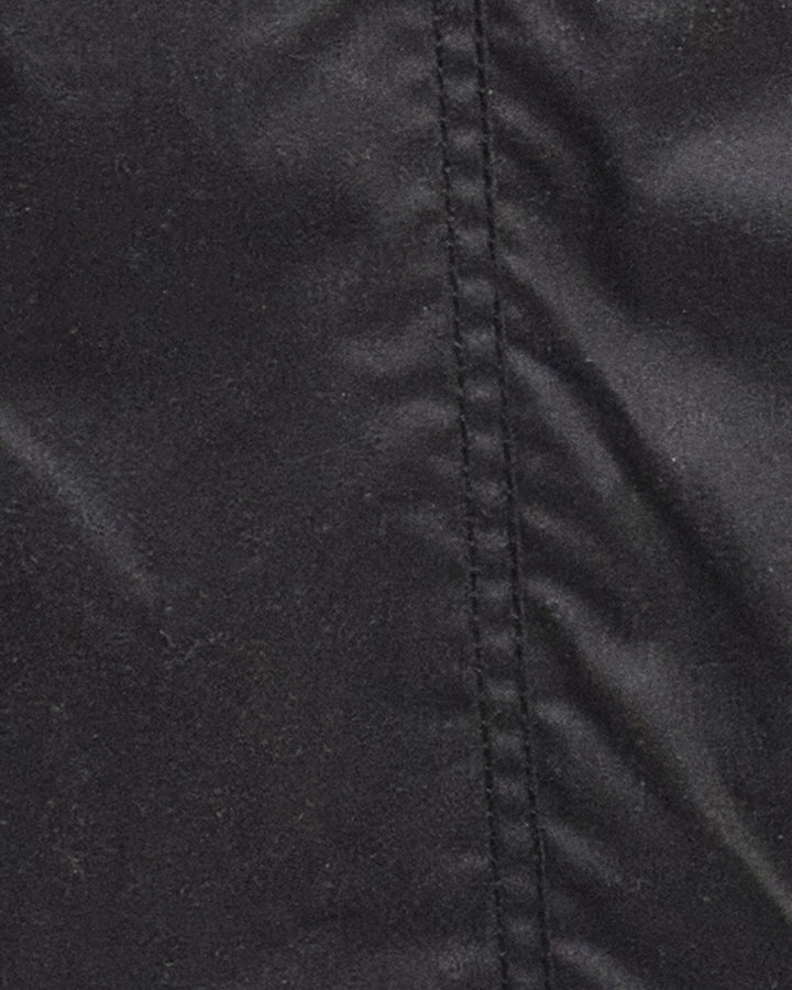 Close-up view of stitching of Barbour Classic Beadnell Jacket in olive wax cotton