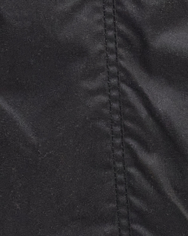 Close-up view of stitching of Barbour Classic Beadnell Jacket in olive wax cotton