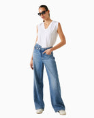 Model view of White jersey V-neck top by GUESS with buttoned epaulettes