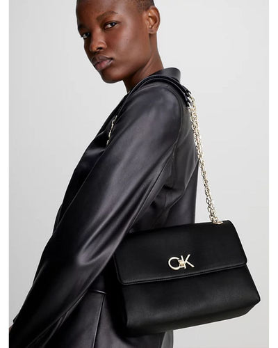 Calvin Klein - Re-Lock EW Convertable Crossbody Bag in Black - Side View