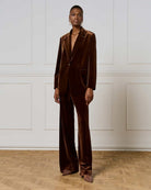 Model wearing jacket with matching trousers for a full velvet look