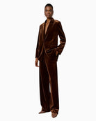 Model wearing jacket with matching trousers for a full velvet look
