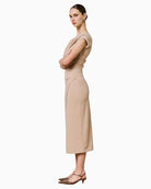 Side view of ruched dress showing fitted silhouette and soft stretch