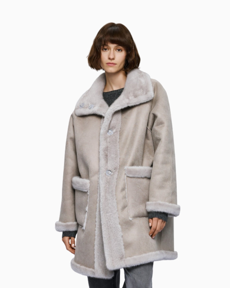 Front view of grey faux fur jacket with button fastening