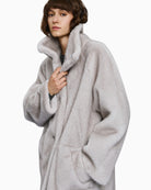 Jacket detail showing buttons and side pocket placement