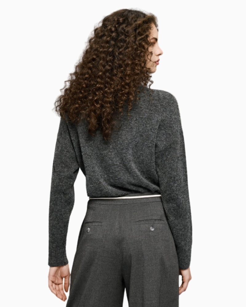 Back view of coal grey knit blouse with ribbed hem