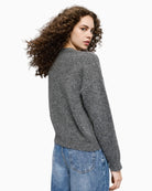 Back view of soft winter jumper in recycled yarn blend