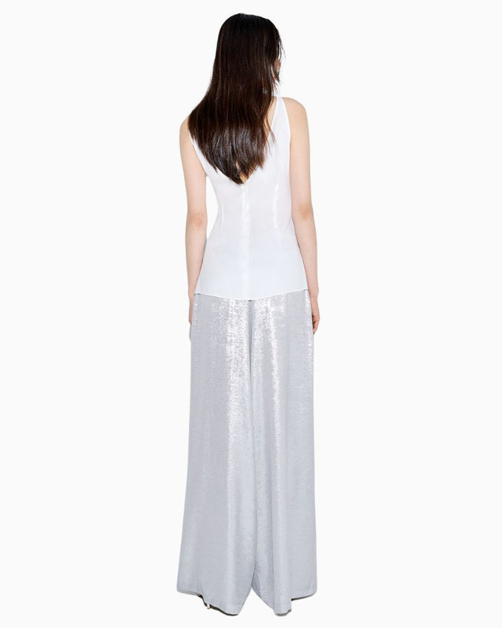 Back view of Access Fashion metallic trousers highlighting structured, shimmering fabric