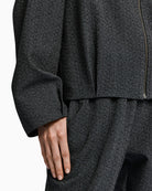 Fabric detail of Dark Grey Bomber Jacket with subtle pleats and sparkling rhinestones