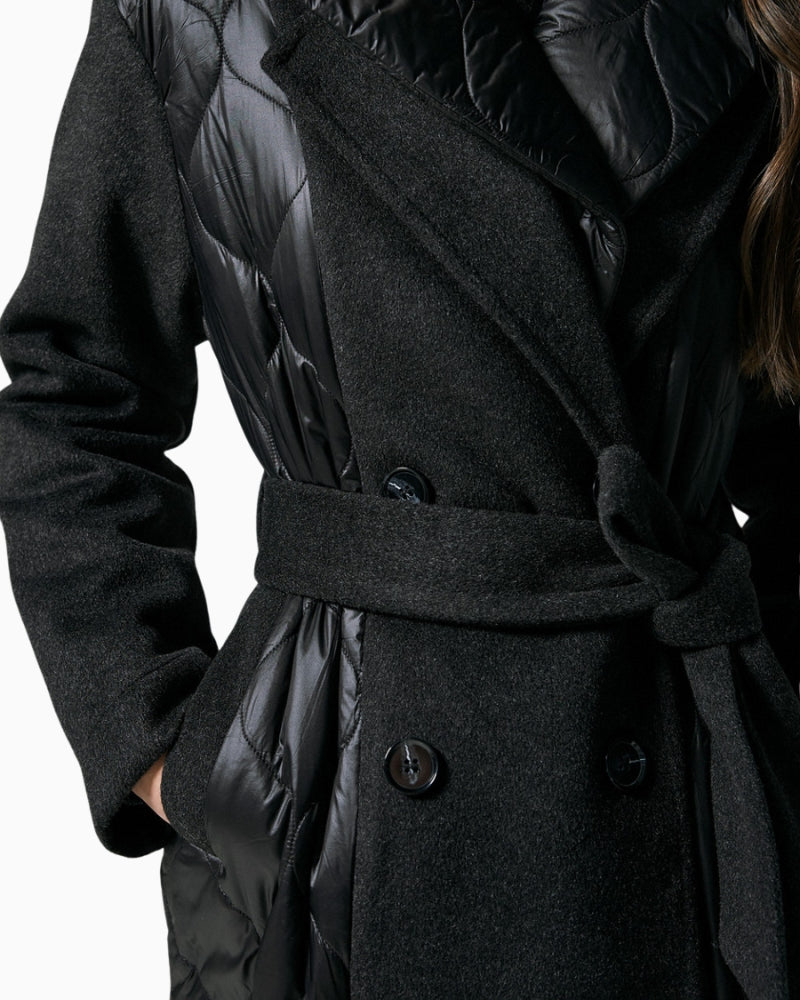 Close-up of quilted fabric and textured finish on black winter coat