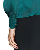 Sleeve detail showing embossed shimmer fabric and cuff buttons