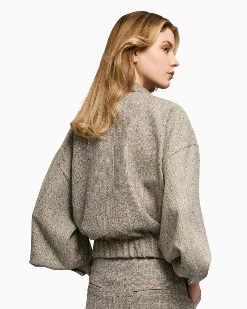 Back view of access grey herringbone jacket with relaxed fit and lined finish