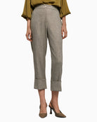 Front view of grey herringbone trousers with turn-up hems and side pockets