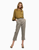Full look with model wearing grey herringbone pants by Access with matching jacket