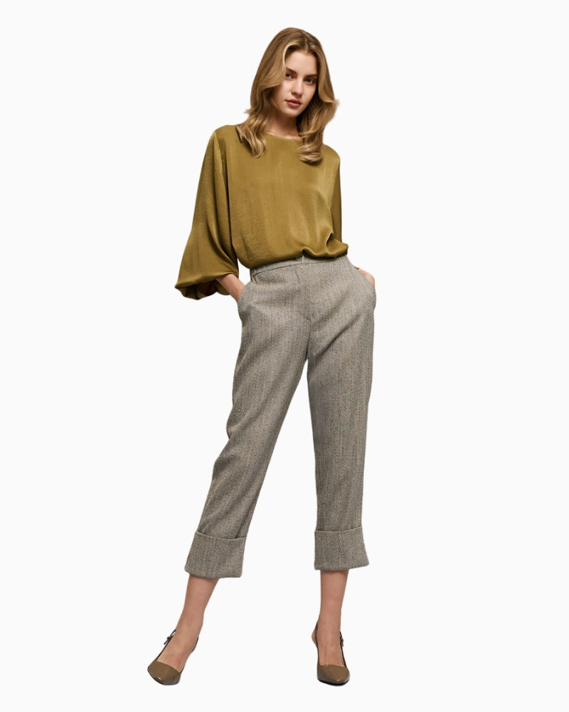 Full look with model wearing grey herringbone pants by Access with matching jacket